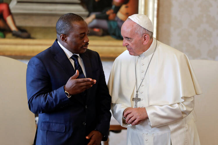 Pope Francis talks with Congolese President Joseph Kabila during a private audience at the Vatican Sept. 26. (CNS photo/Andrew Medichini, pool via Reuters)