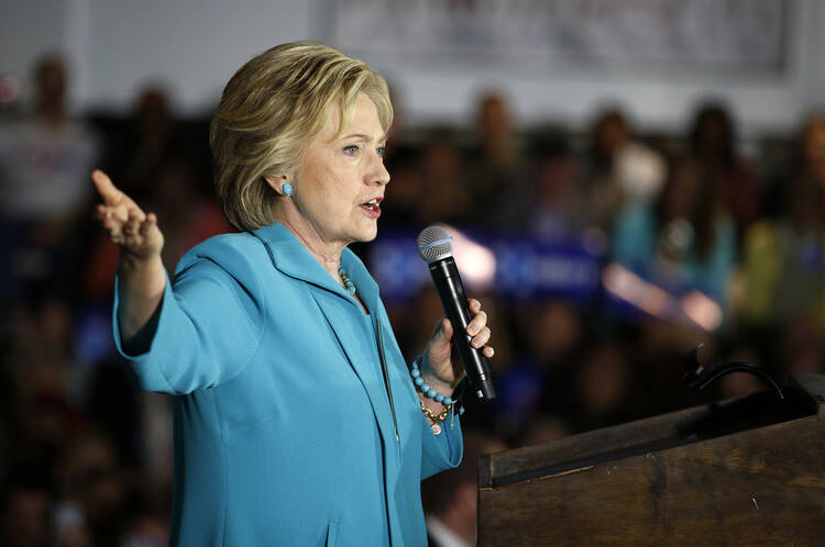 Hillary Clinton stands alone in promising to continue President Obama's steady course. (AP Photo/John Locher)