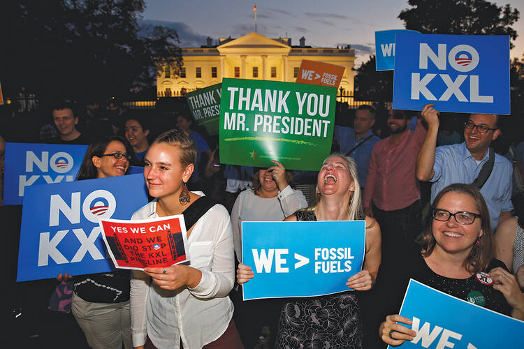 Thanks, Obama! Activists celebrate outside the White House after the Obama administration’s rejection of the Keystone XL pipeline on Nov. 6.